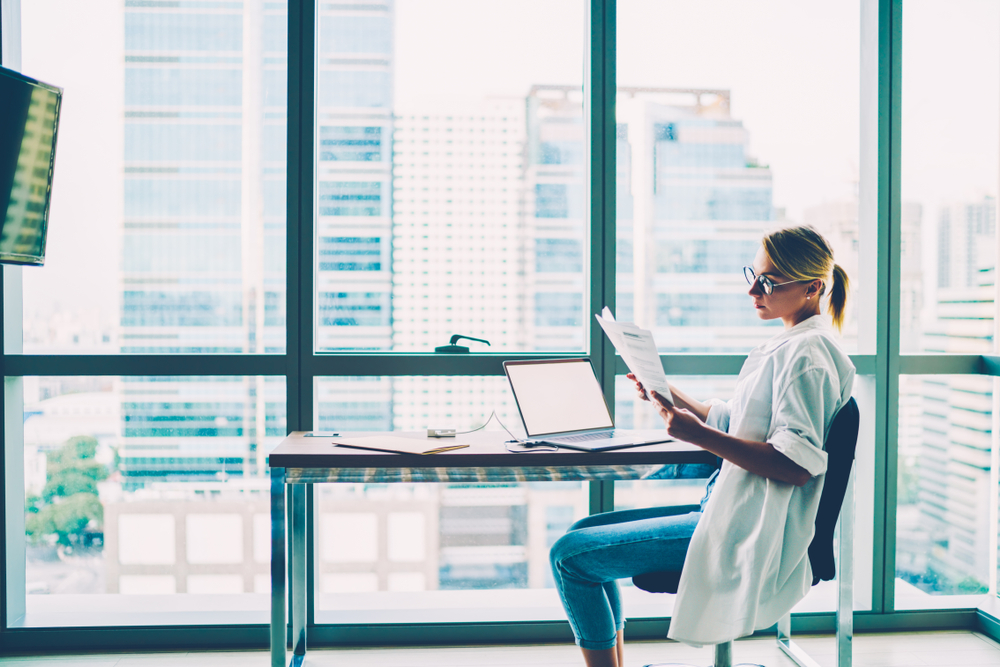 Professional analyzing business systems on a desktop computer with application modernization services that enhance performance, security, and scalability.

