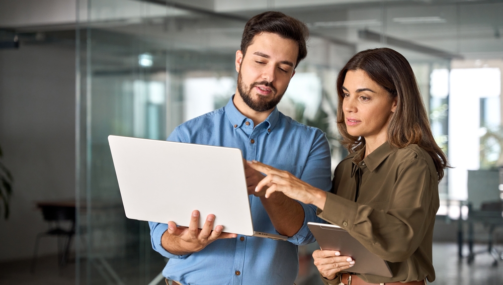 Enterprise architect discussing an application modernization strategy roadmap with a team member
