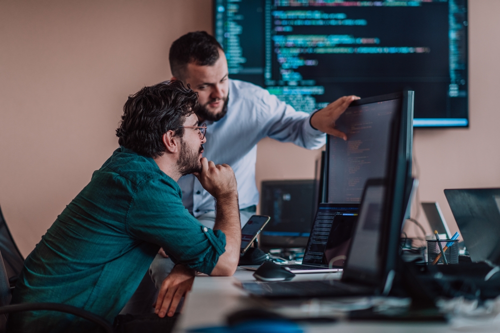 Enterprise IT team reviewing application rationalization data during a portfolio meeting
