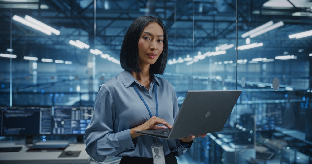 IT team analyzing legacy applications on multiple screens before they migrate lotus domino to exchange as part of a digital transformation initiative.