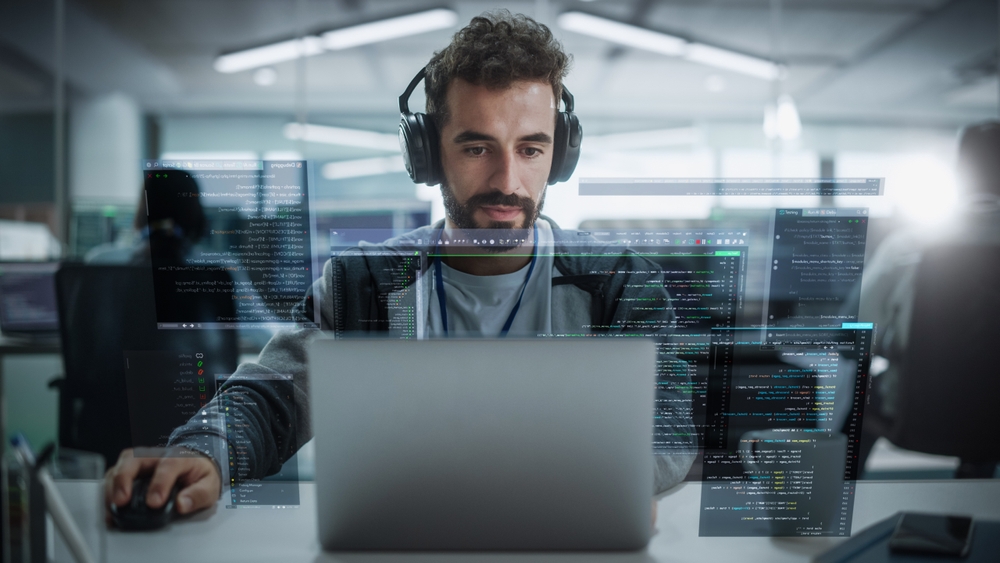 Developer discussing application dependencies during digital transformation strategy planning
